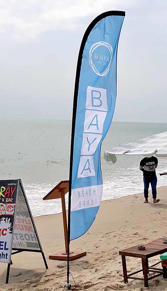 Baya beach restaurant in lamai beach make beautiful beach flags with heavy sand screw