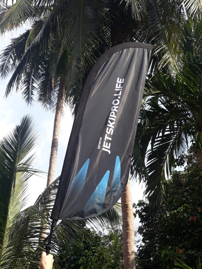 beautiful jetskipro life feather beach flag middle of jungle