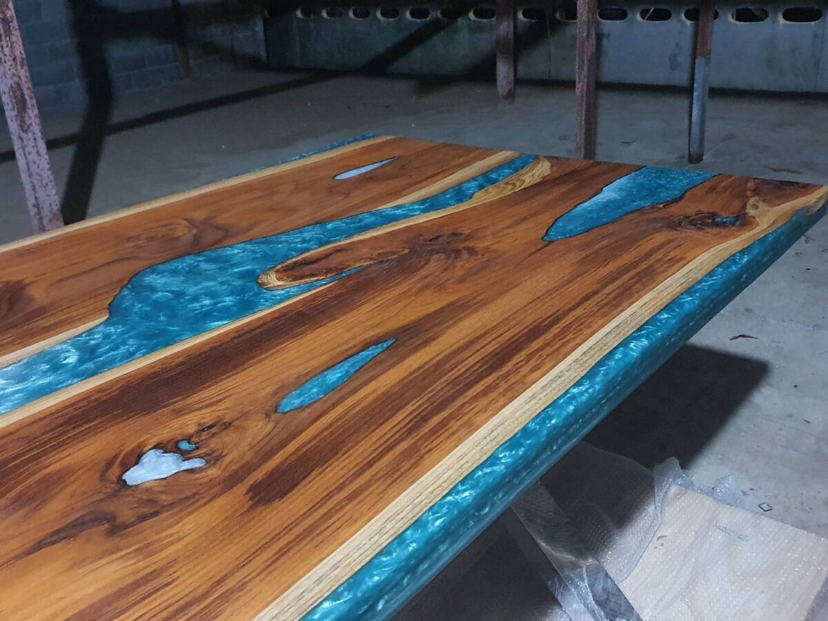 Teak wood epoxy river table with blue and white color mixed art