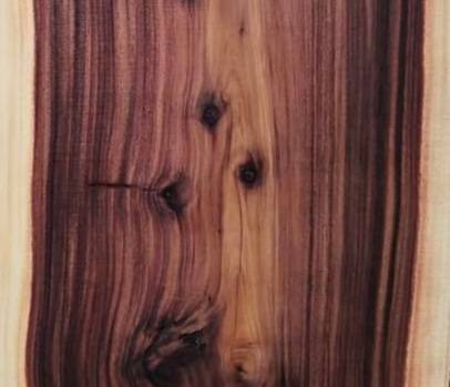 Beautiful acacia wood surface with brach knot design